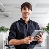 person holding a tablet and smiling