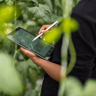 person holding a tablet outside