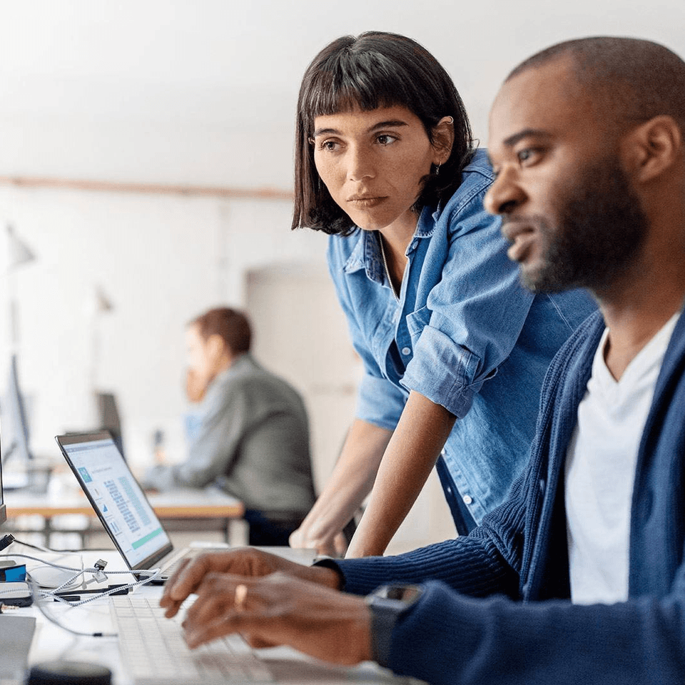 two people working together