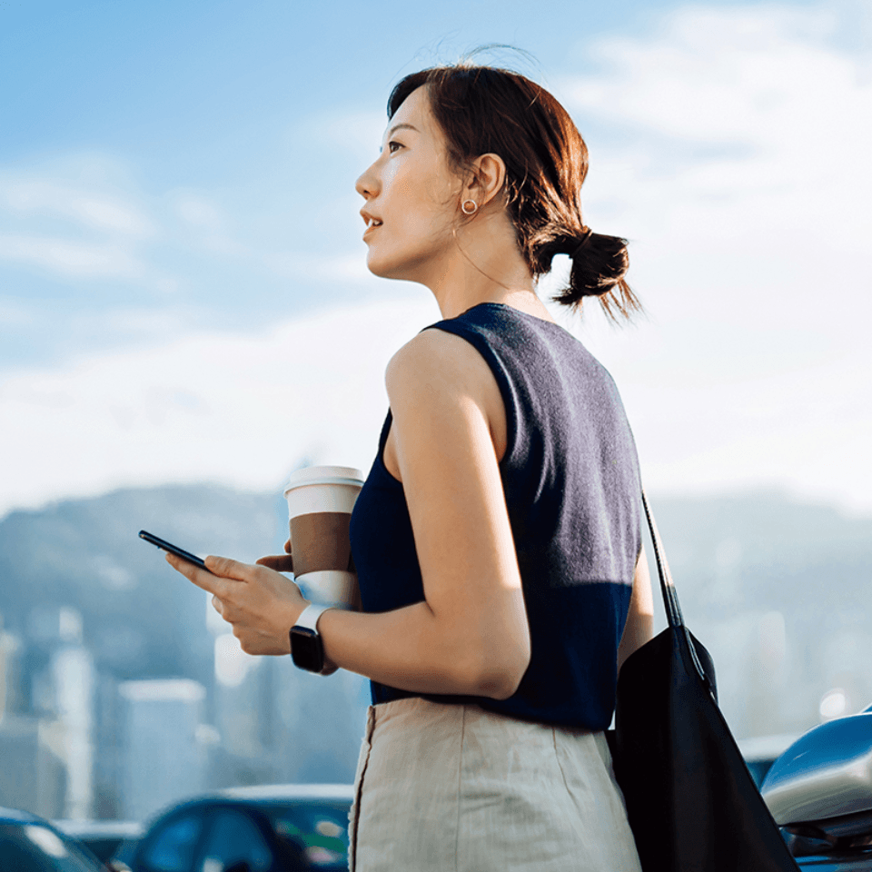 A woman exploring the area with her phone