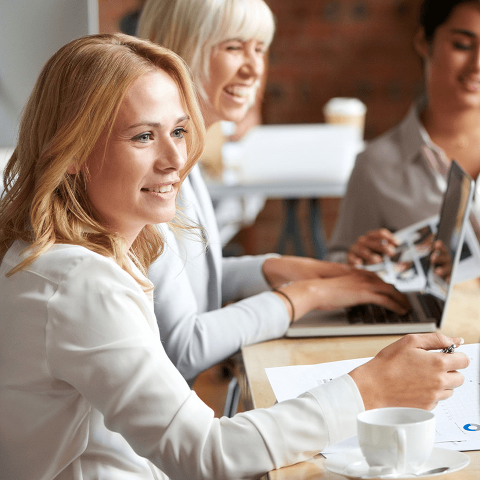 three women at desk