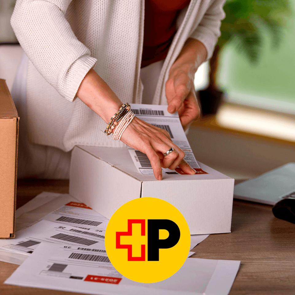 a woman labeling a package