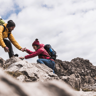 couple climbing a mountain