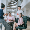 a group of four people talking