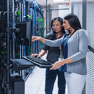 2 woman in a data center room