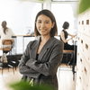 Confident woman in office workspace.
