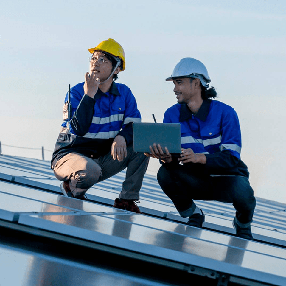 Two man working on solar panels