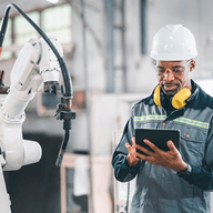 A engineer holding a ablet