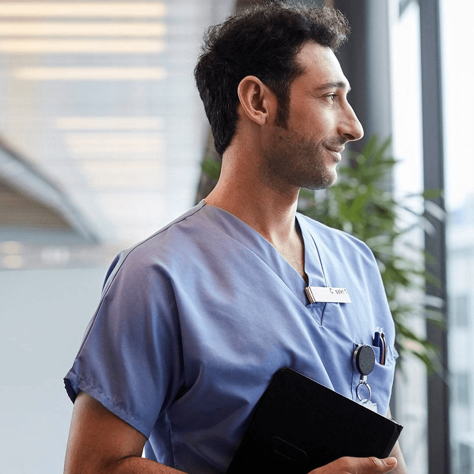 nurse looking at a window