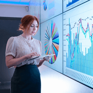 Woman analyzing charts on tablet