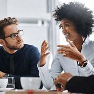 Two colleagues engaged in discussion.