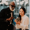 Two colleagues discussing smartphone data.