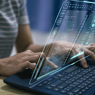 Person typing on laptop.