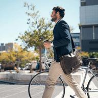 A man walking with his bike