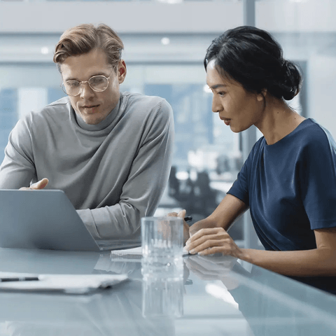 two co-workers working together