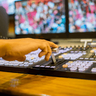 A hand typing on a keyboard