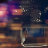 professional video camcorder in studio with blurred background