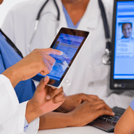 doctor holding a tablet